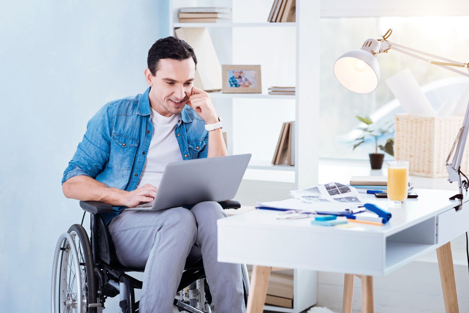 Enigmatical male person working with computer